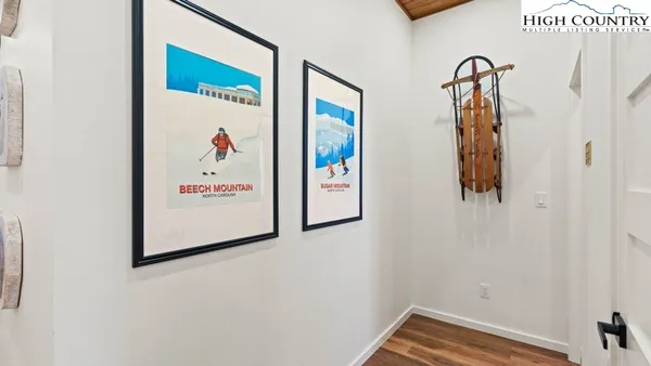 a bathroom with a granite countertop sink mirror vanity and toilet