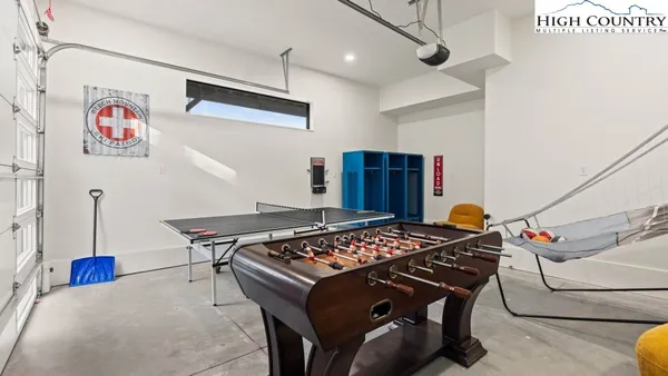 a room with gym equipment and view of living room