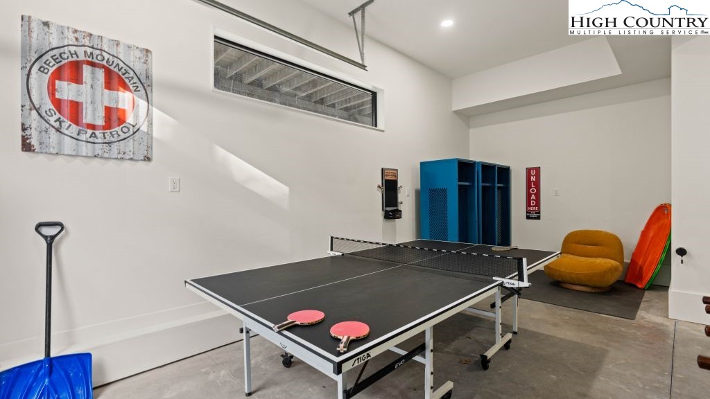 114 Windridge Road Beech Mountain, NC 28604 - Photo 27 of 49 a room with furniture and air hockey table