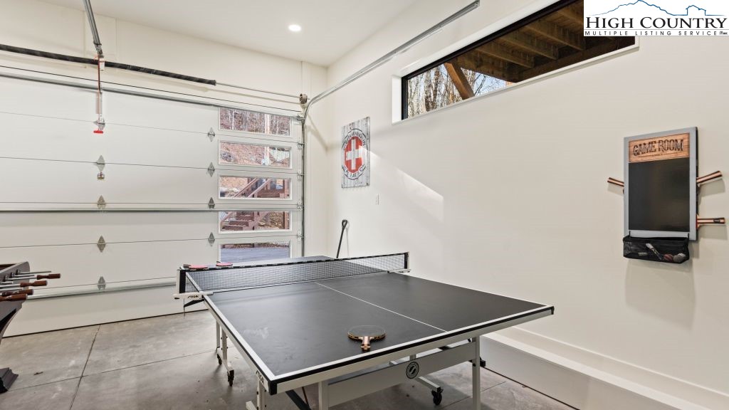 114 Windridge Road Beech Mountain, NC 28604 - Photo 28 of 49 a room with gym equipment and view of living room