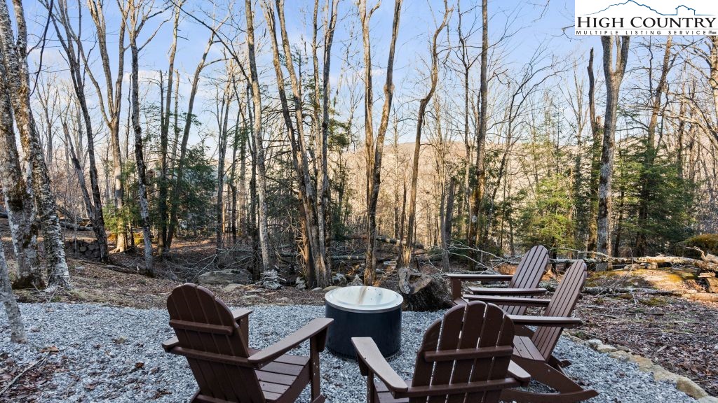 114 Windridge Road Beech Mountain, NC 28604 - Photo 32 of 49 a view of a chairs and table in backyard