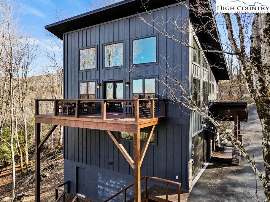 114 Windridge Road Beech Mountain, NC 28604 - Photo 38 of 49 a view of a house with pool and sitting area