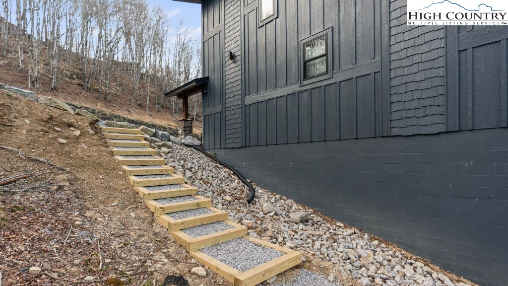 114 Windridge Road Beech Mountain, NC 28604 - Photo 39 of 49 a view of a pathway with a building