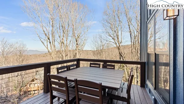 a view of balcony and deck with furniture