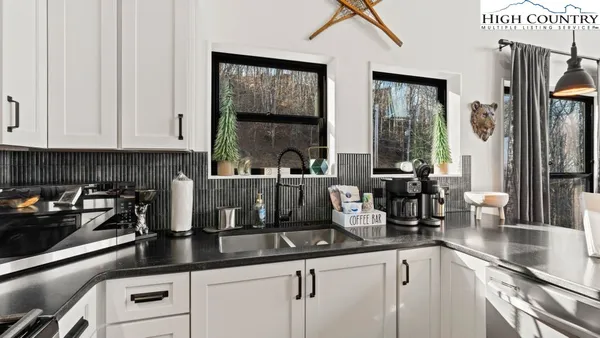 a kitchen with counter top space cabinets and stainless steel appliances