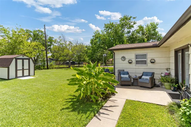 a house view with swimming pool and garden