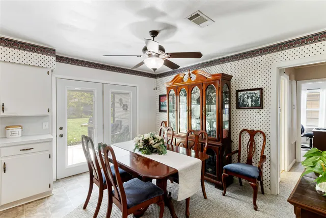 a kitchen with stainless steel appliances a refrigerator and a table