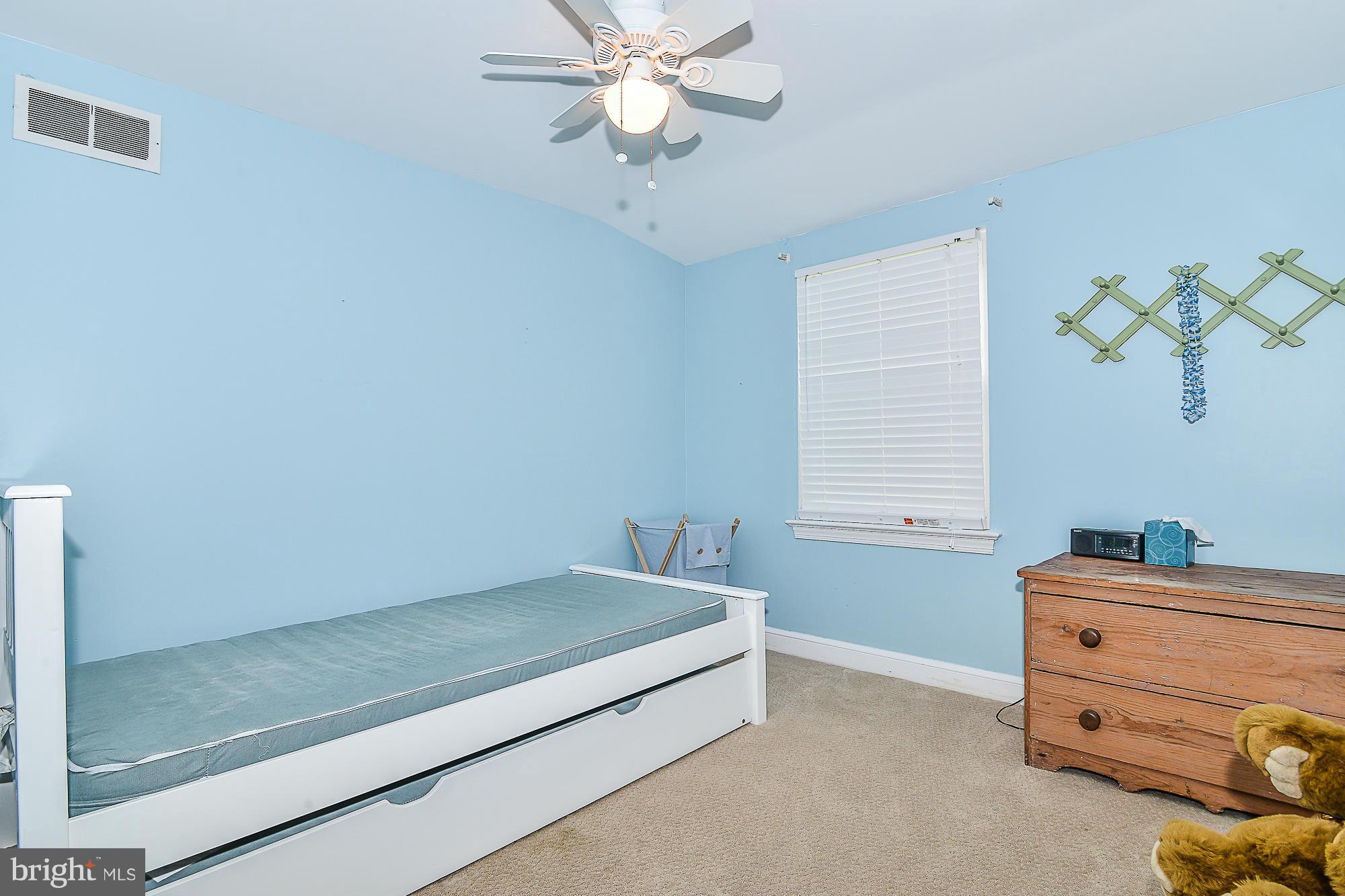 511 Kerwin Court Silver Spring, MD 20901 - Photo 14 of 21 a bedroom with a bed and a window