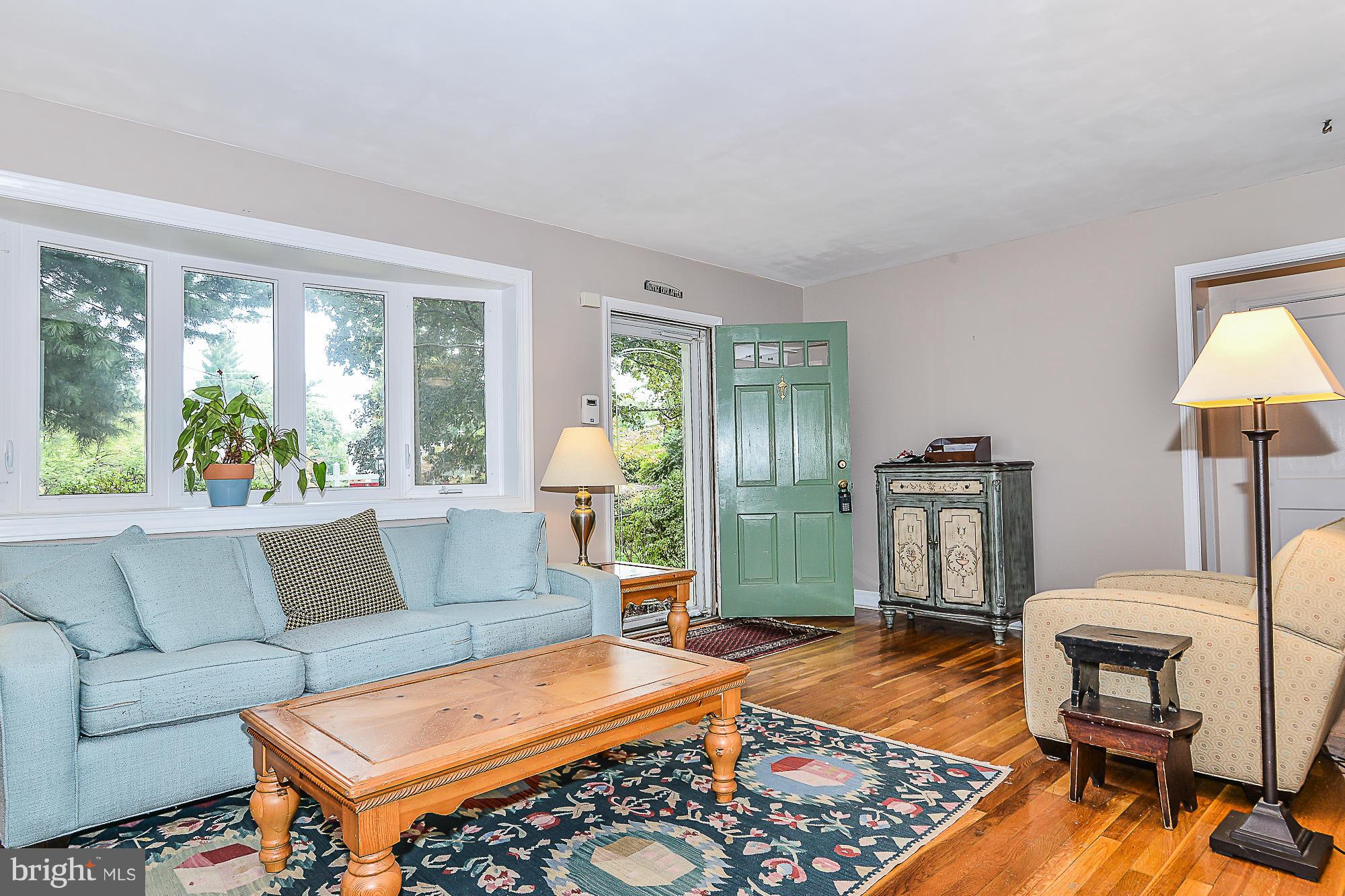 511 Kerwin Court Silver Spring, MD 20901 - Photo 3 of 21 a living room with furniture a rug and a window