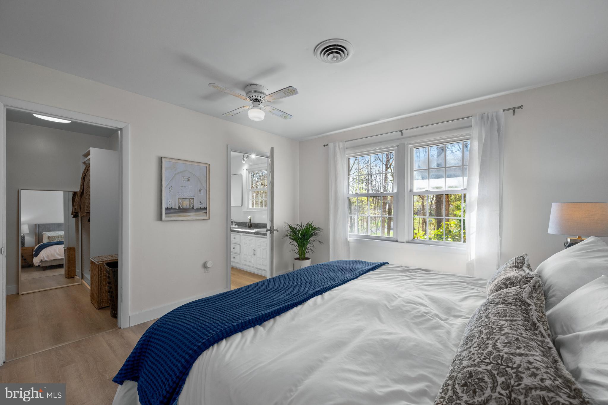 932 Western Chapel Road Westminster, MD 21157 - Photo 26 of 48 a bedroom with a large bed and a chandelier