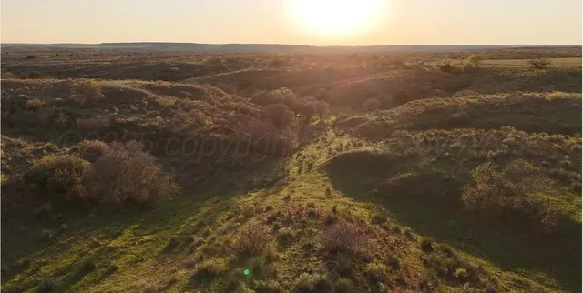 a view of a lake from a mountain