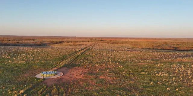 an aerial view of residential building and ocean