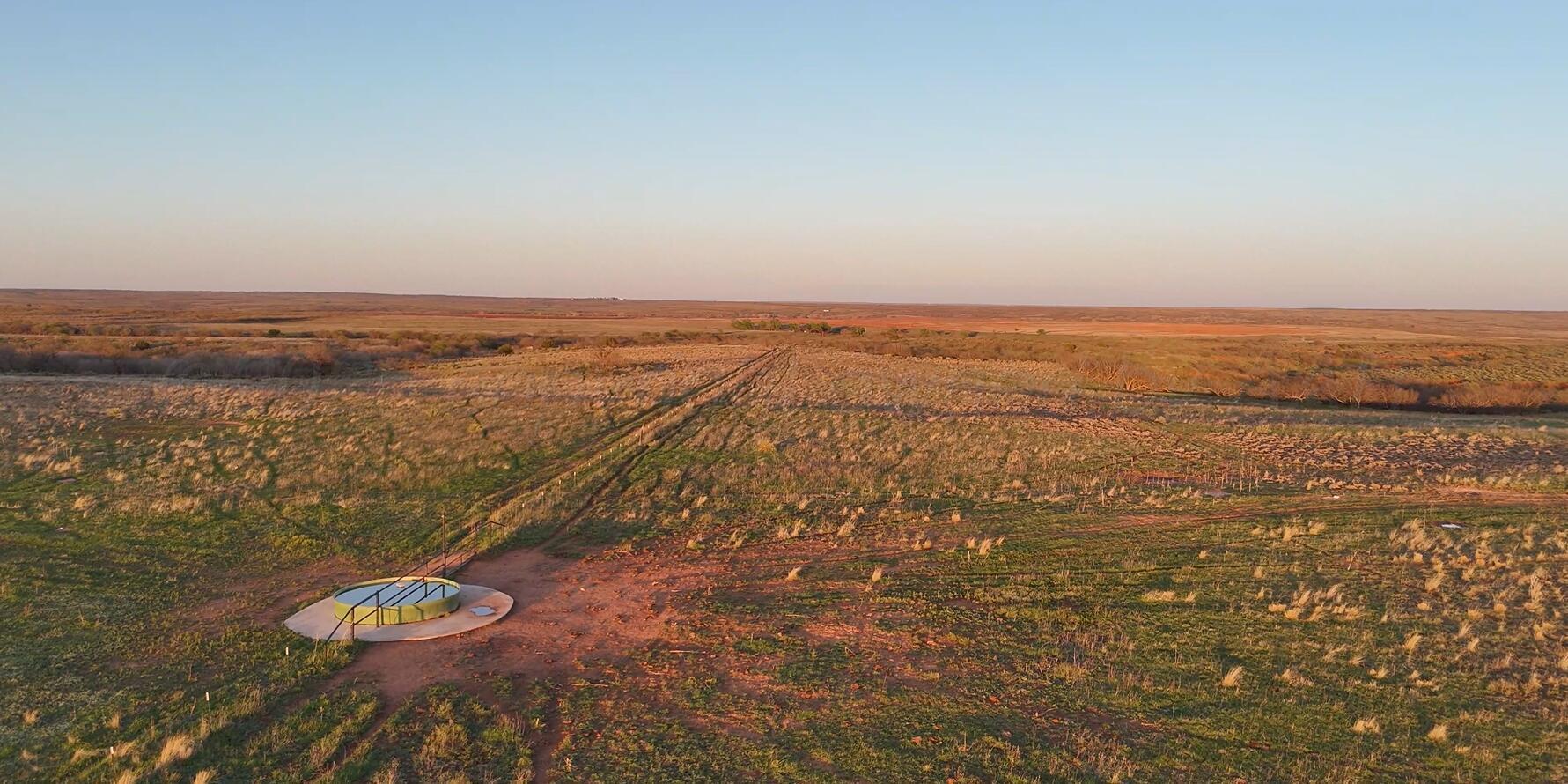 90 Co Road Memphis, TX 79245 - Photo 4 of 7 an aerial view of residential building and ocean