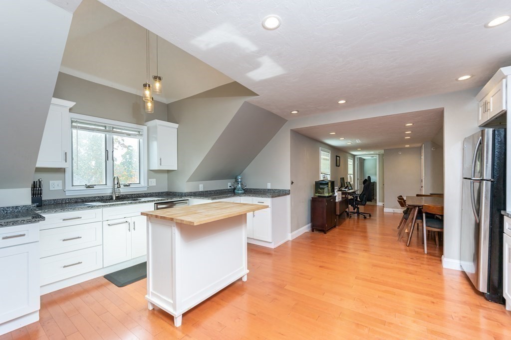 a kitchen with lots of counter top space and living room