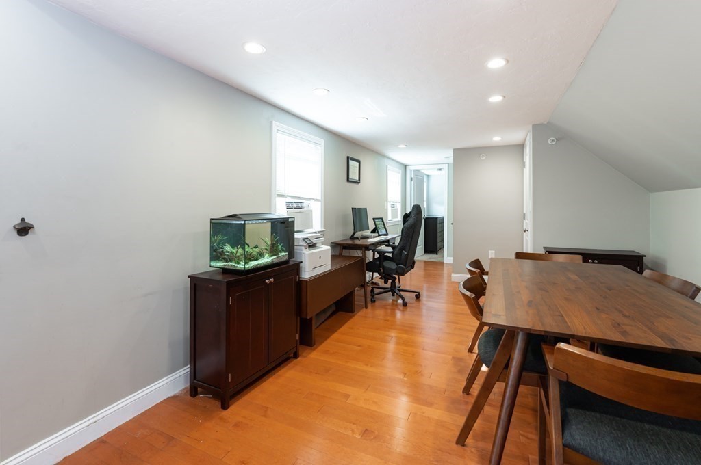 8 Putnam Street, Unit 3 Danvers, MA 01923 - Photo 13 of 32 a living room with furniture and a wooden floor
