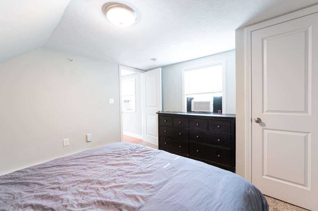 8 Putnam Street, Unit 3 Danvers, MA 01923 - Photo 16 of 32 a bedroom with a bed and a dresser