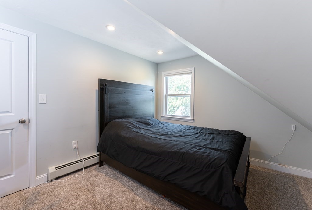8 Putnam Street, Unit 3 Danvers, MA 01923 - Photo 20 of 32 a bedroom with a bed and window