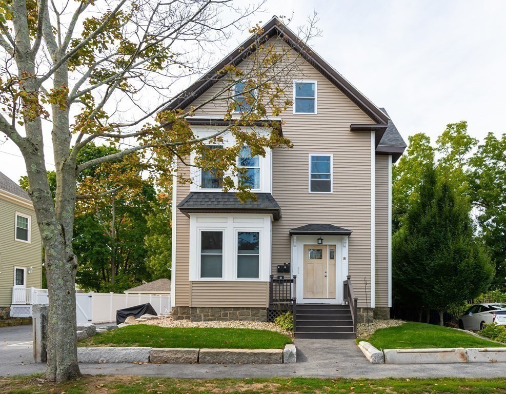 8 Putnam Street, Unit 3 Danvers, MA 01923 - Photo 2 of 32 a front view of a house with a yard