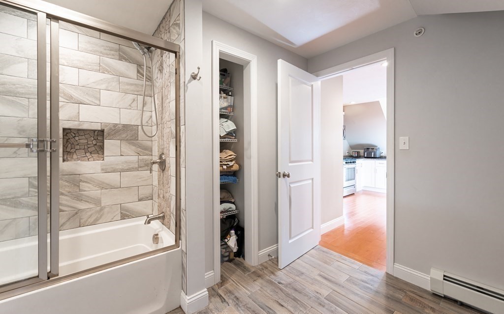 8 Putnam Street, Unit 3 Danvers, MA 01923 - Photo 21 of 32 a bathroom with a tub shower and sink