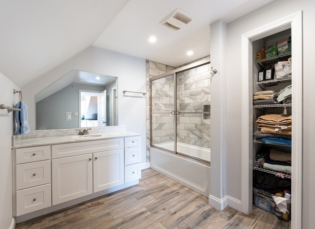 8 Putnam Street, Unit 3 Danvers, MA 01923 - Photo 23 of 32 a spacious bathroom with double vanity and a shower