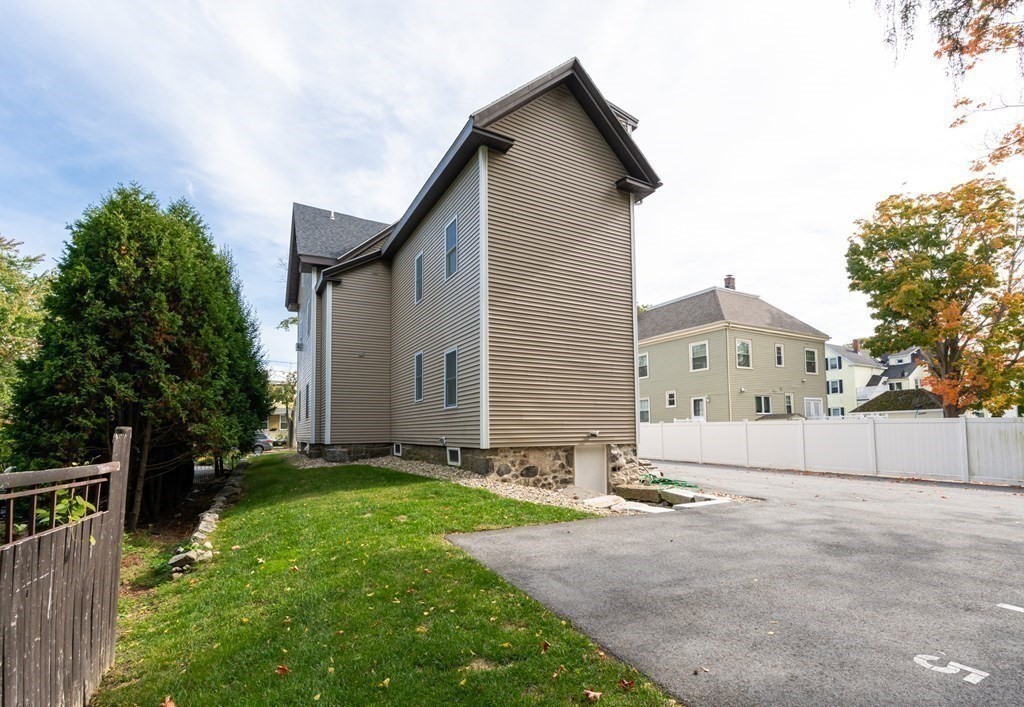 8 Putnam Street, Unit 3 Danvers, MA 01923 - Photo 31 of 32 a backyard of a house with lots of green space