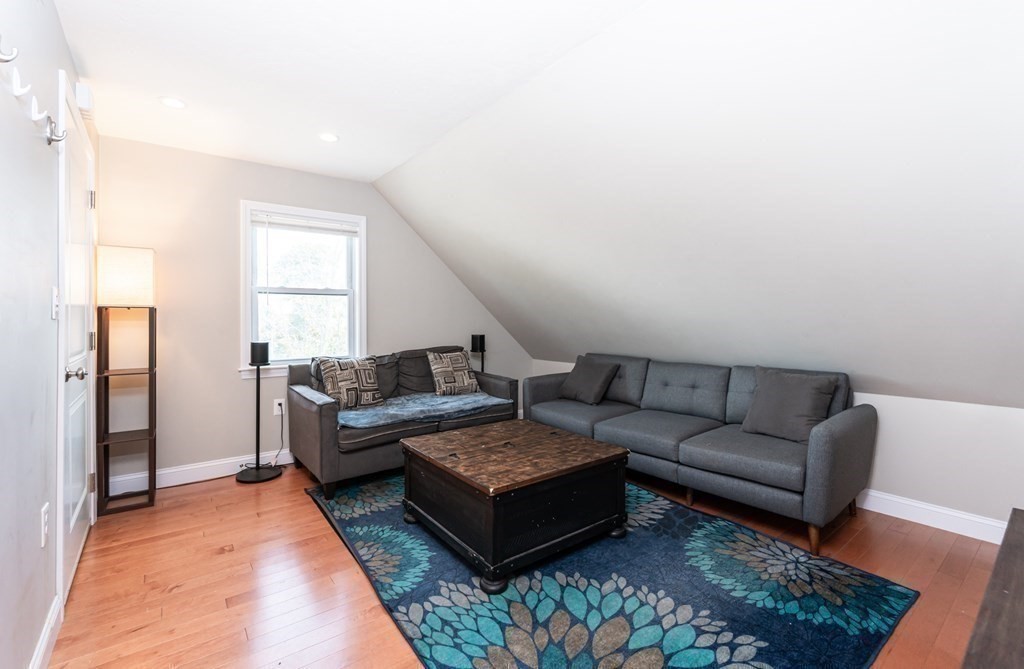 8 Putnam Street, Unit 3 Danvers, MA 01923 - Photo 5 of 32 a living room with furniture and a rug