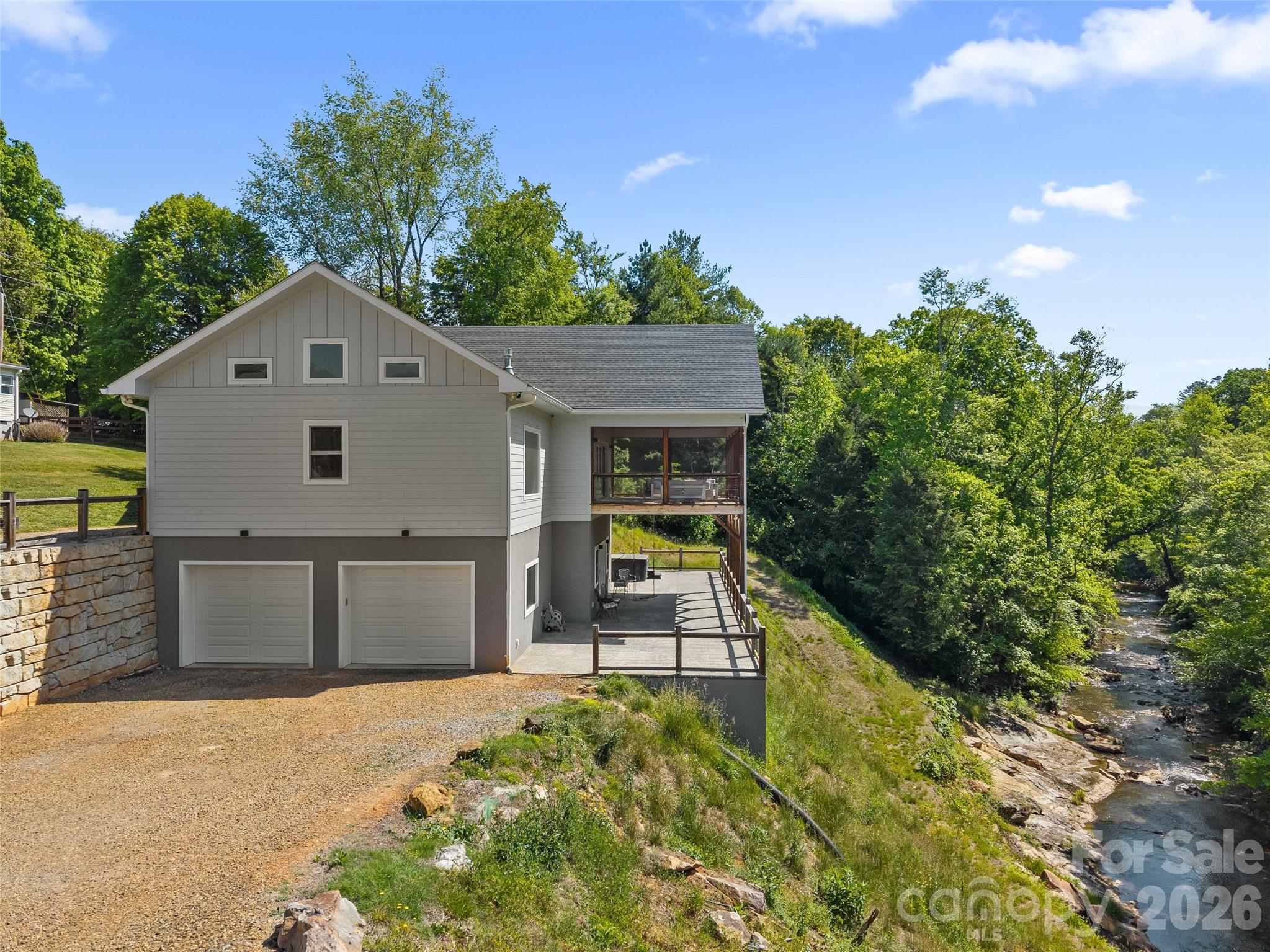 123 Israel Road Candler, NC 28715 - Photo 3 of 44 a house view with a garden space