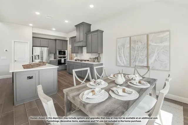 a dining room with furniture a table and kitchen view