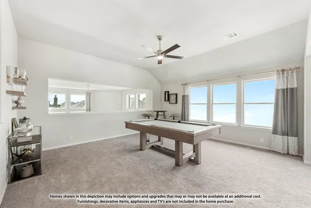 a room with furniture pool table and windows