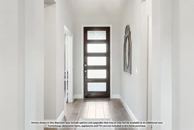 a view of a floor to ceiling window and wooden floor