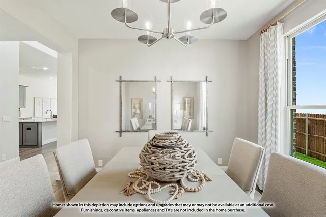 a living room with furniture a rug and a chandelier