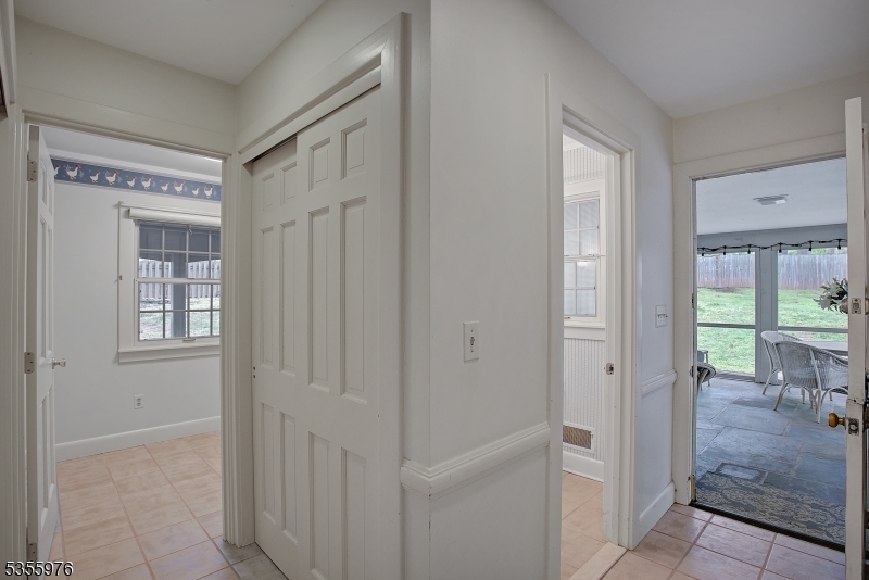 14 William Barnes Road Flemington, NJ 08822 - Photo 18 of 31 a view of a hallway with windows and a bathroom
