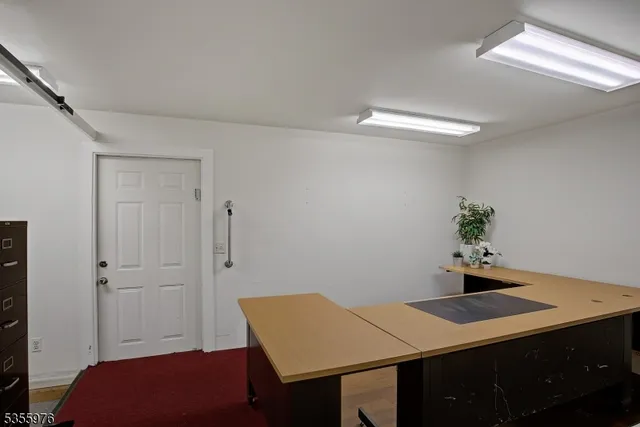 a view of a hallway with hallway with closet