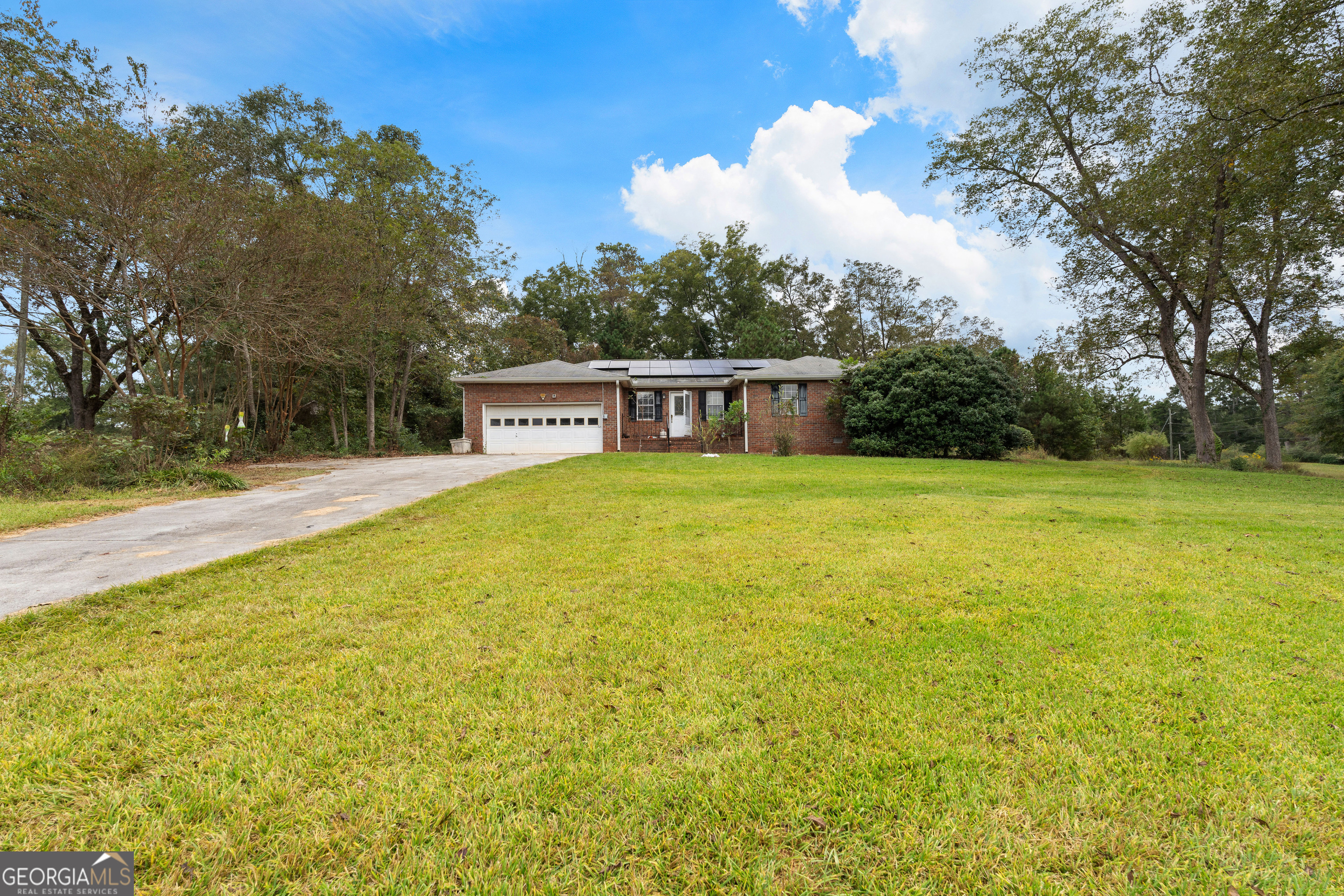 1948 Highway 16 Newnan, GA 30263 - Photo 1 of 1 a view of a swimming pool with an outdoor space and seating area