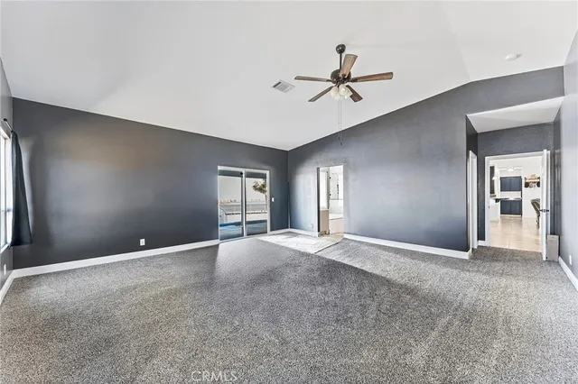 a spacious bathroom with a bathtub shower sink double and mirror