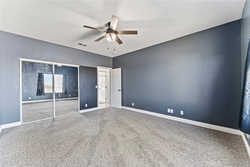 2700 Olivera Road Pinon Hills, CA 92371 - Photo 24 of 37 a view of an empty room with window and cabinet