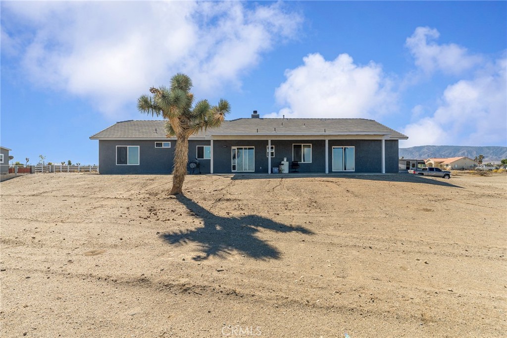 2700 Olivera Road Pinon Hills, CA 92371 - Photo 27 of 37 a front view of a house with a yard