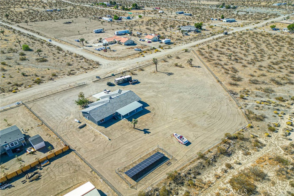 2700 Olivera Road Pinon Hills, CA 92371 - Photo 34 of 37 wooden floor with building view