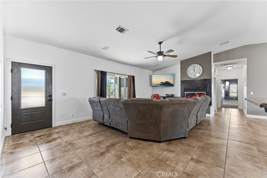 2700 Olivera Road Pinon Hills, CA 92371 - Photo 6 of 37 a living room with furniture and wooden floor