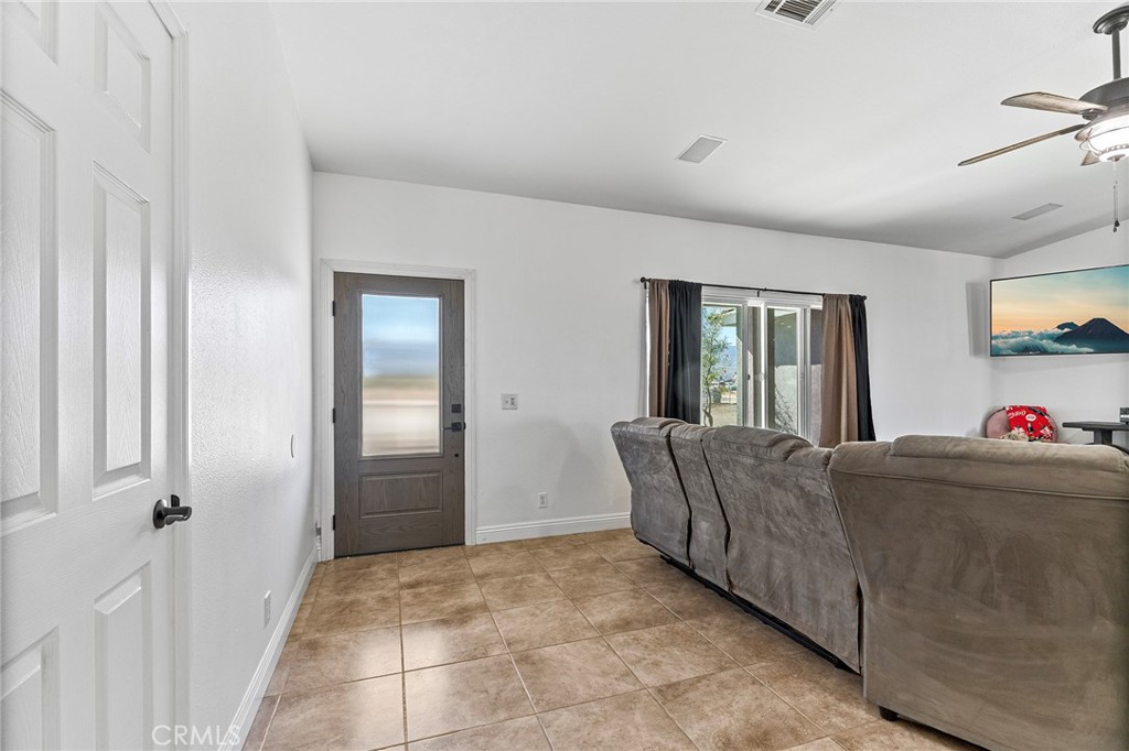 2700 Olivera Road Pinon Hills, CA 92371 - Photo 7 of 37 a living room with furniture and a window