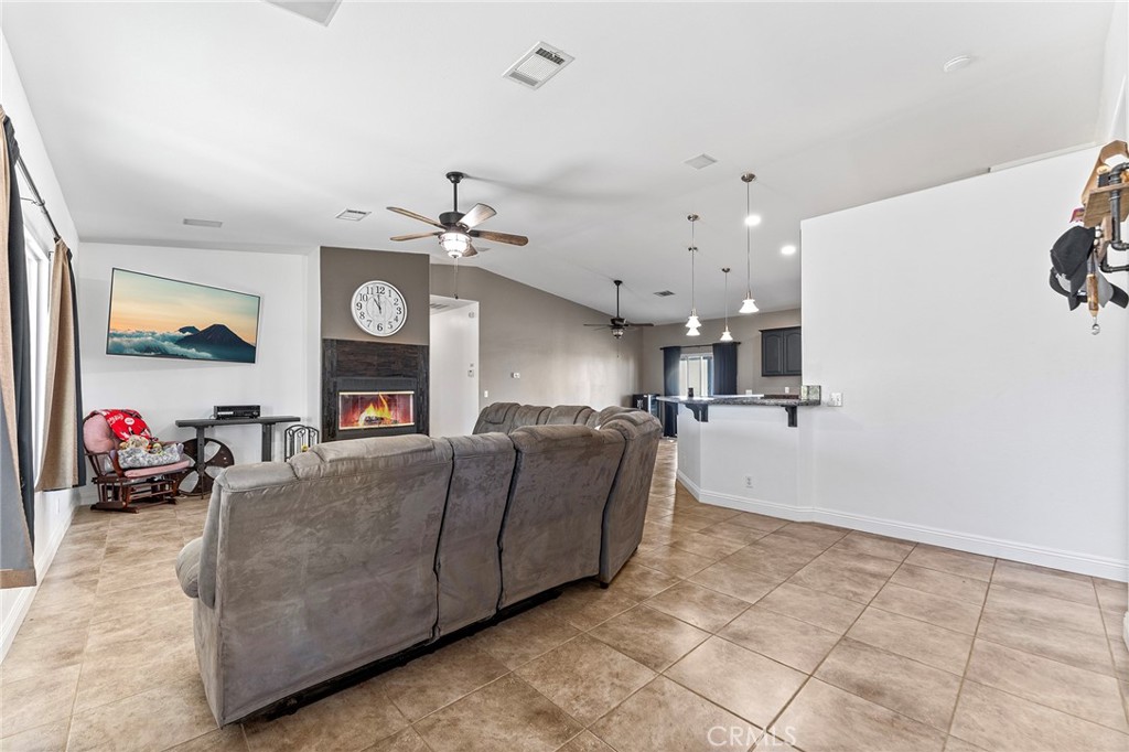 2700 Olivera Road Pinon Hills, CA 92371 - Photo 8 of 37 a living room with furniture and a fireplace