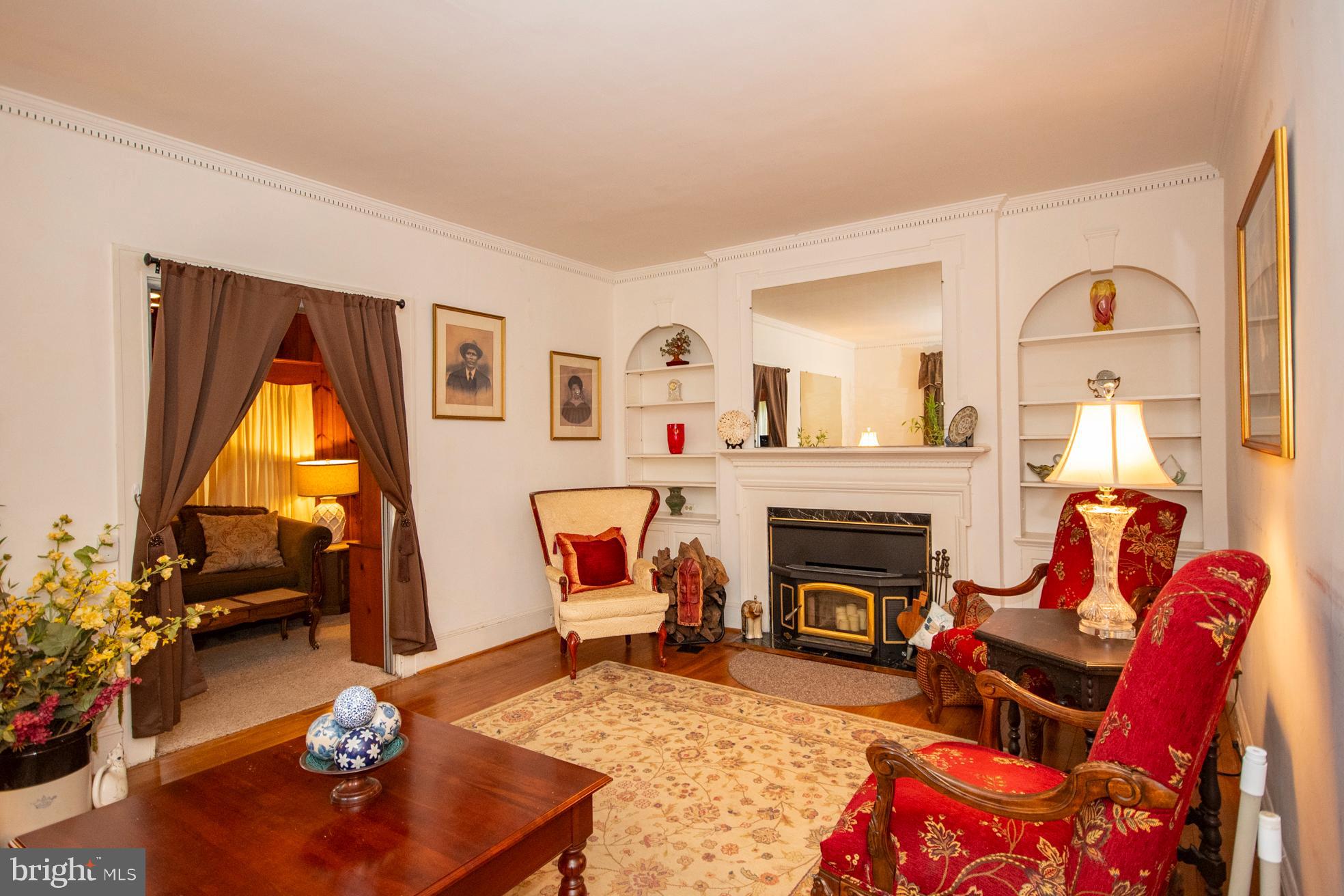 2705 Queen Anne Road Baltimore, MD 21216 - Photo 11 of 29 Formal Living Room with Wood burning Fireplace
