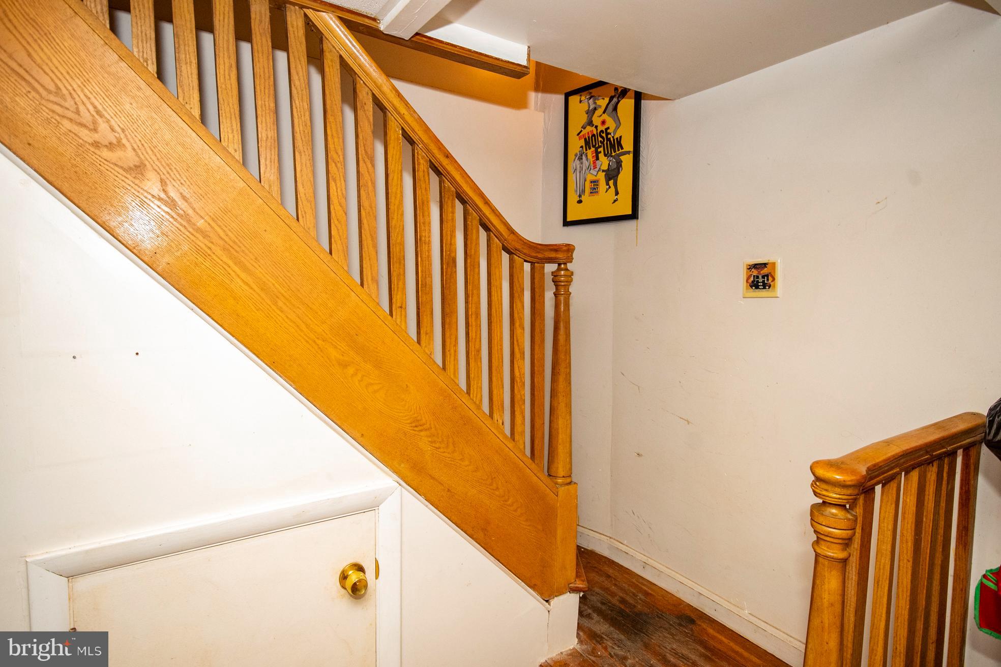 2705 Queen Anne Road Baltimore, MD 21216 - Photo 26 of 29 Wooden Staircase to Lower Level