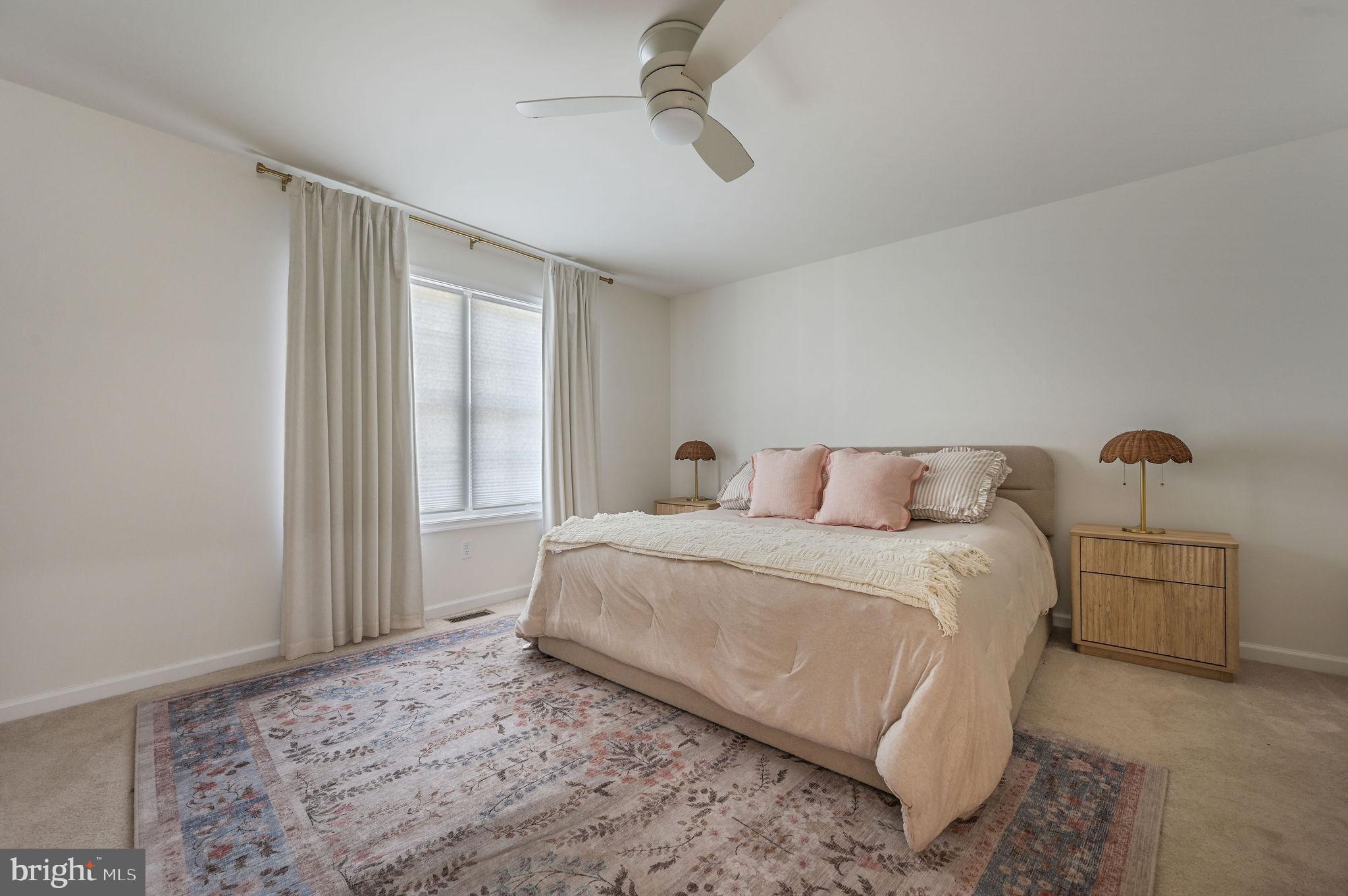7 Porter Street Harrington, DE 19952 - Photo 13 of 24 a spacious bedroom with a bed and window