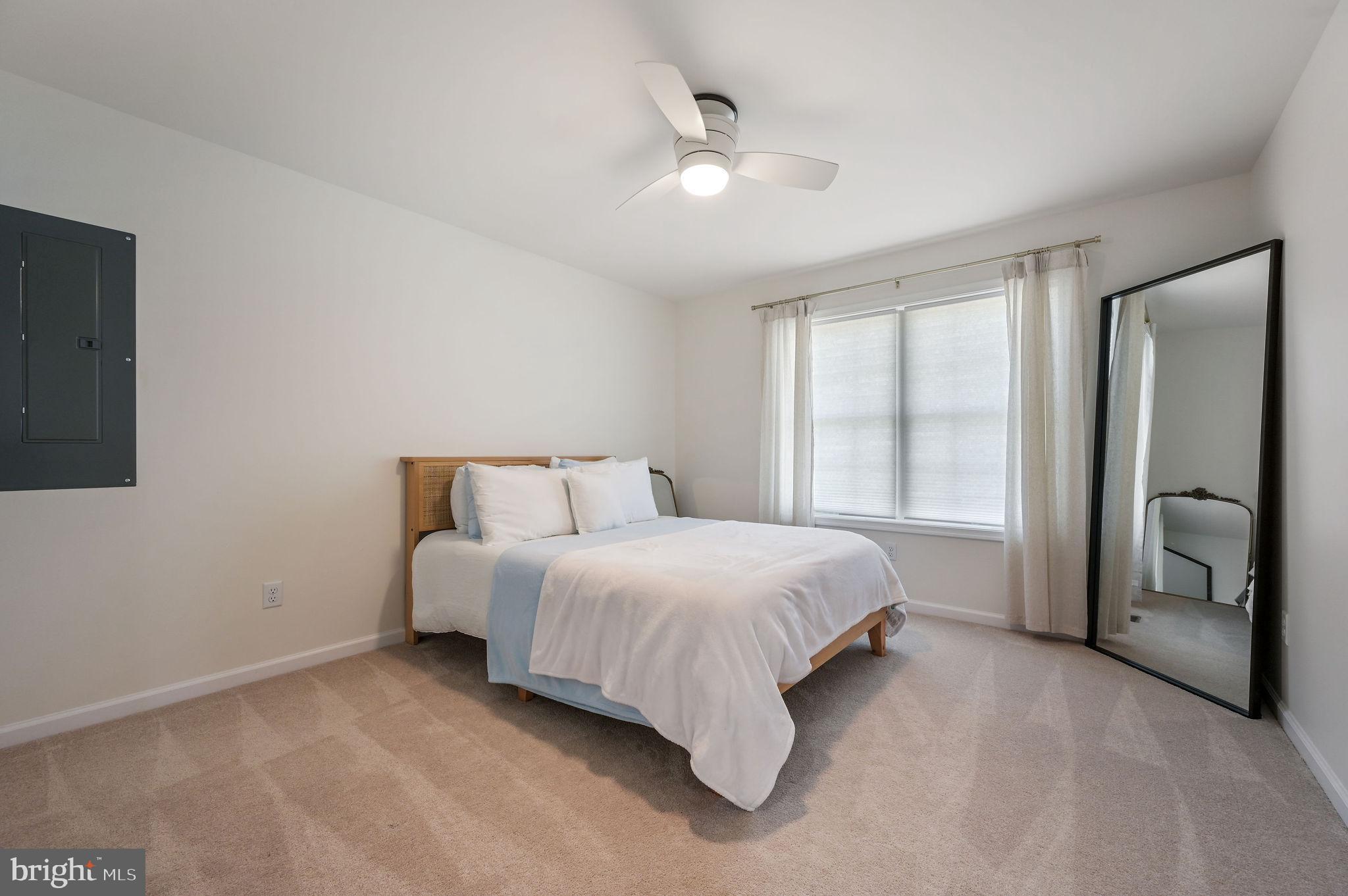7 Porter Street Harrington, DE 19952 - Photo 19 of 24 a bedroom with a bed and a large mirror