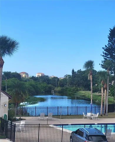a view of a roof deck with wooden fence and floor