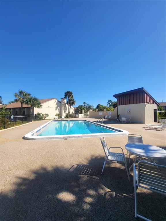 2707B Hidden Lake Boulevard, Unit D Sarasota, FL 34237 - Photo 19 of 20 a balcony with furniture and city view
