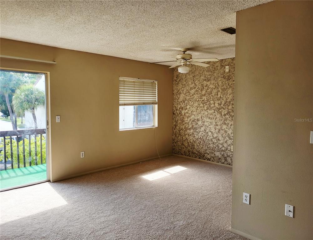 2707B Hidden Lake Boulevard, Unit D Sarasota, FL 34237 - Photo 2 of 20 a view of an empty room with a window