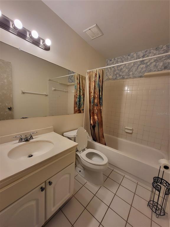 2707B Hidden Lake Boulevard, Unit D Sarasota, FL 34237 - Photo 4 of 20 a bathroom with a sink toilet and shower