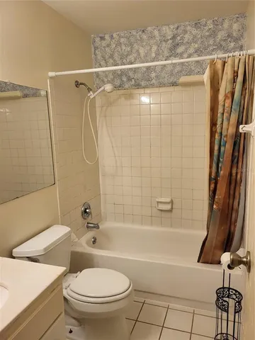 a bathroom with a toilet and a bathtub